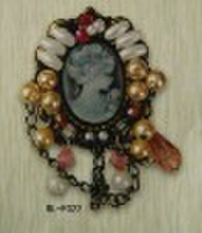 beauty head brooch