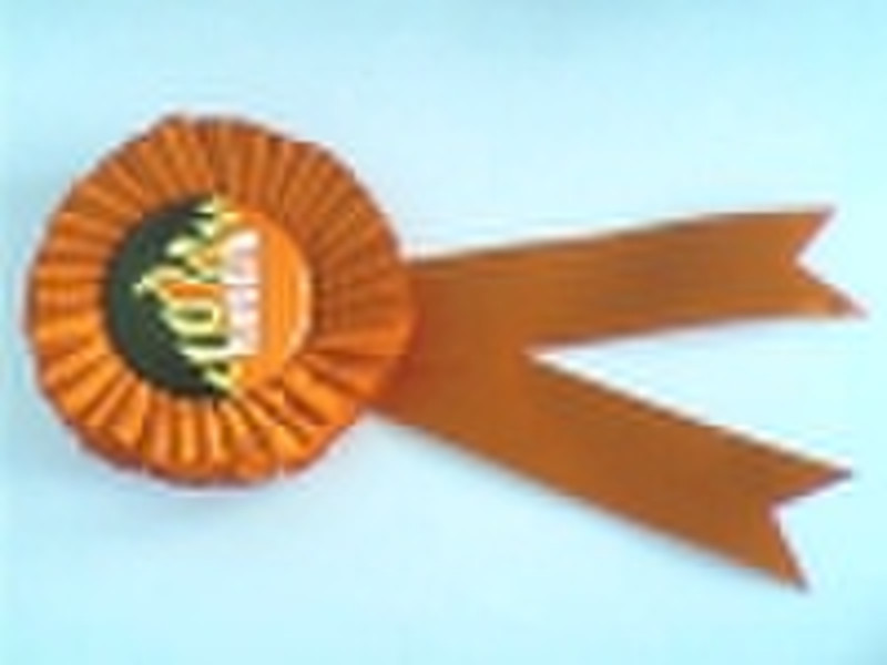 tin badge with ribbon