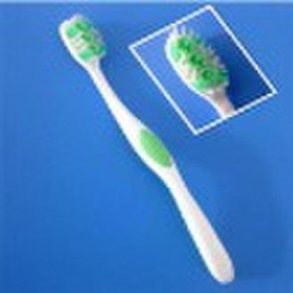 Adult toothbrush with tongue cleaner