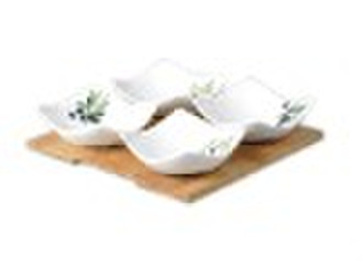 Ceramic snack set on bamboo tray