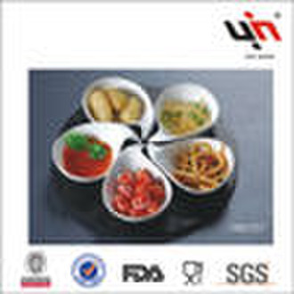 Porcelain dish on wooden tray