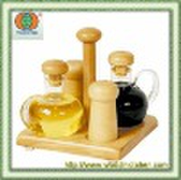 glass oil and vinegar bottles with wooden rack