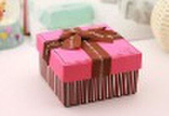 Pink gift packing paper box with decorative ribbon