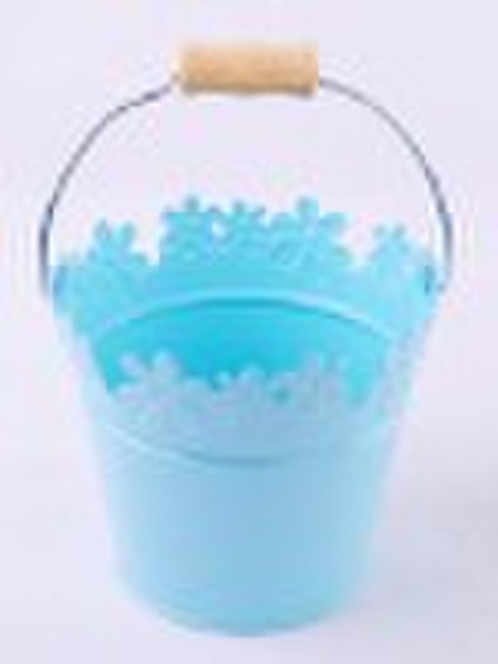 round  flower pot with flower rim and wooden handl