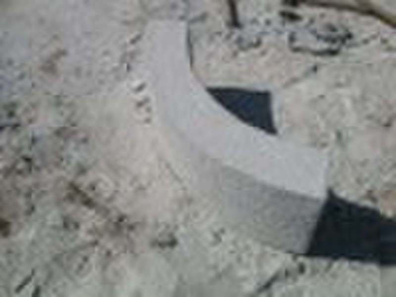 Curved gray granite curbstone